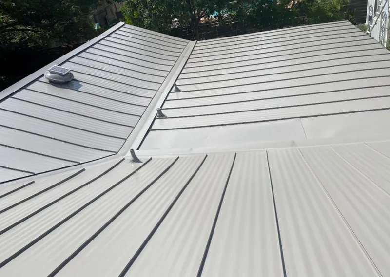 Solar attic fan installed on a metal roof for Roof Ventilation in High Springs